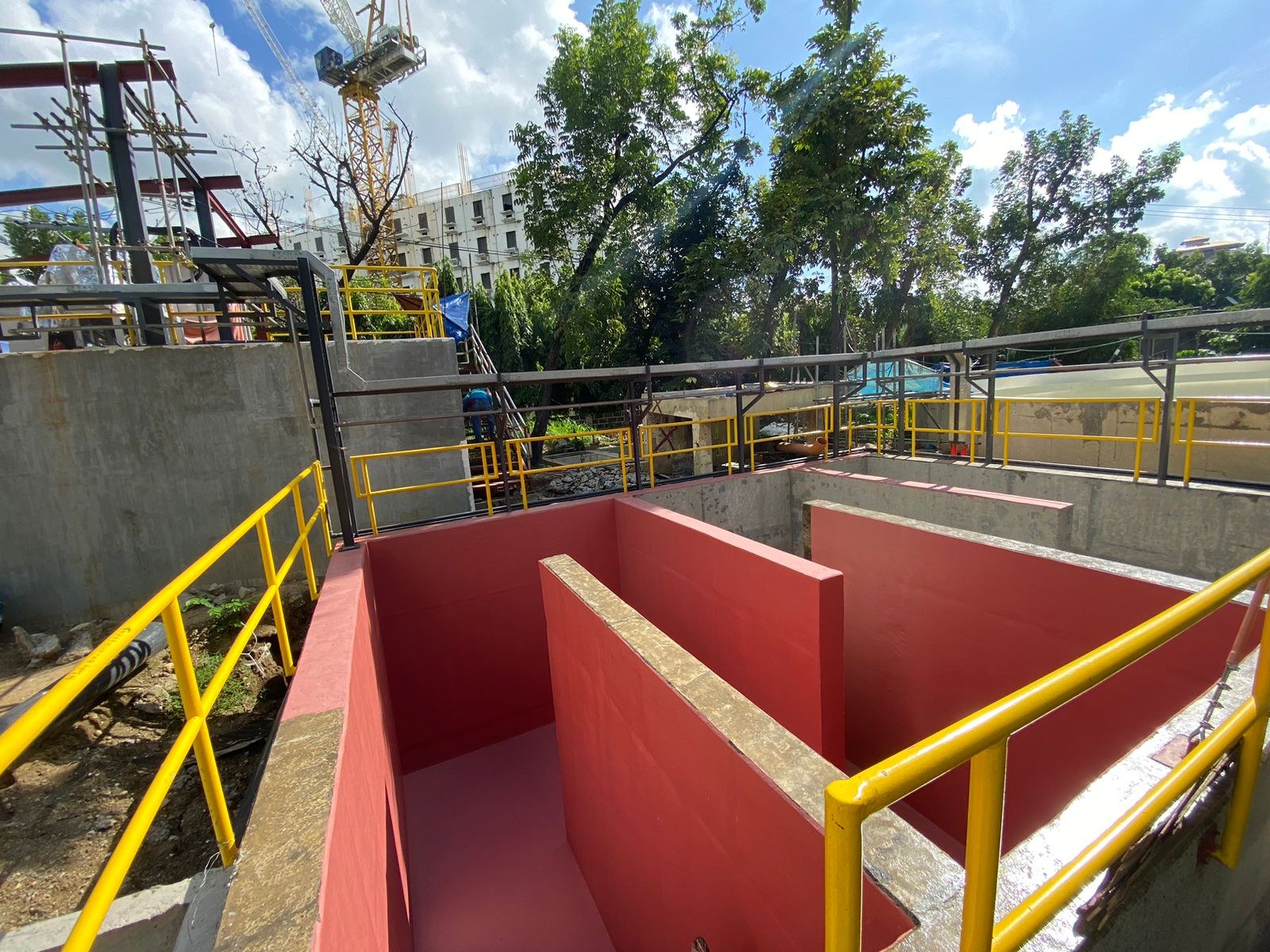 Disinfection tank baffles and red interior finish at Cebu Business Park.