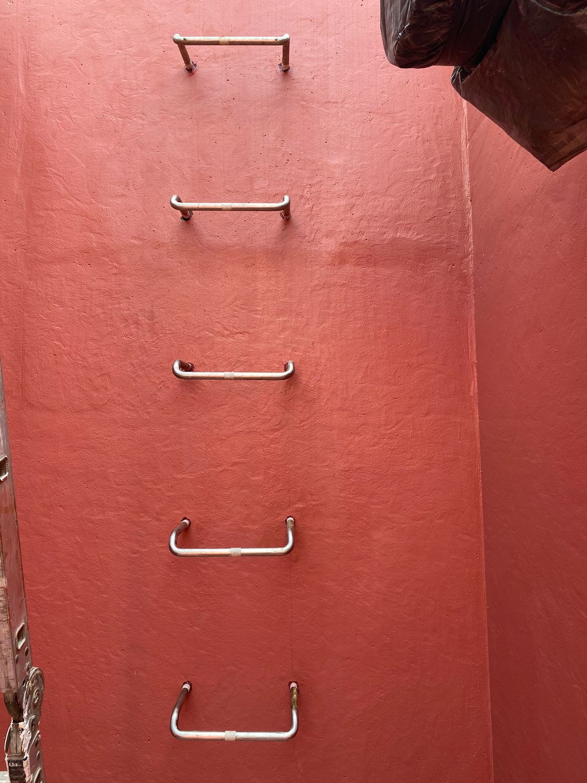 Access rungs in the disinfection tank wall.