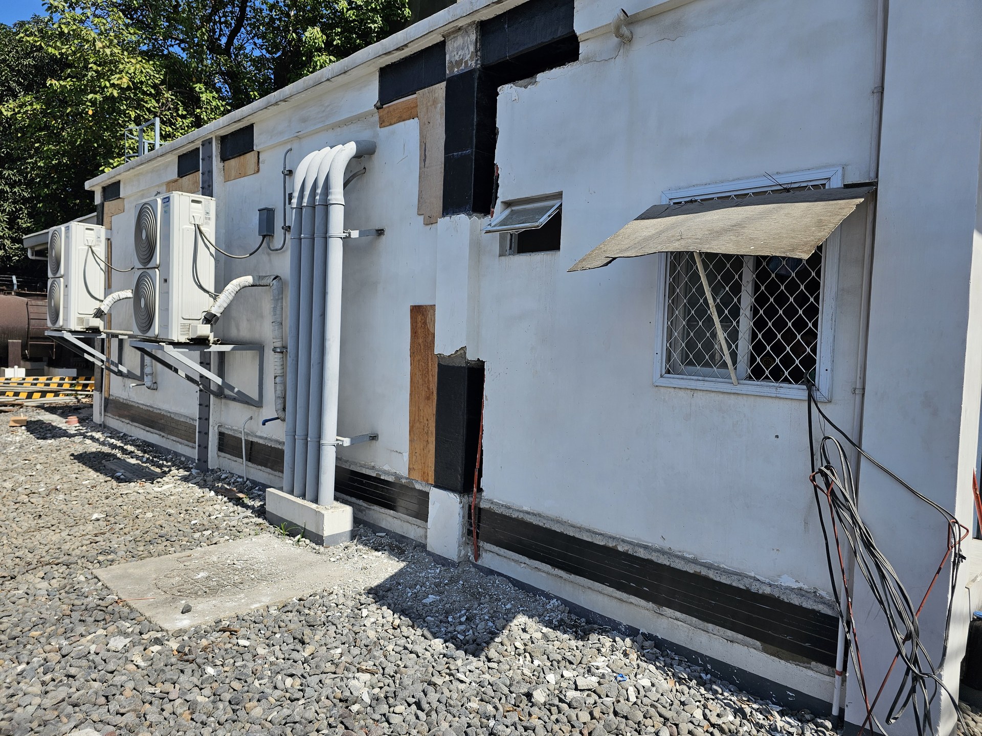 POI shelter exterior with reinforcement visible around openings.