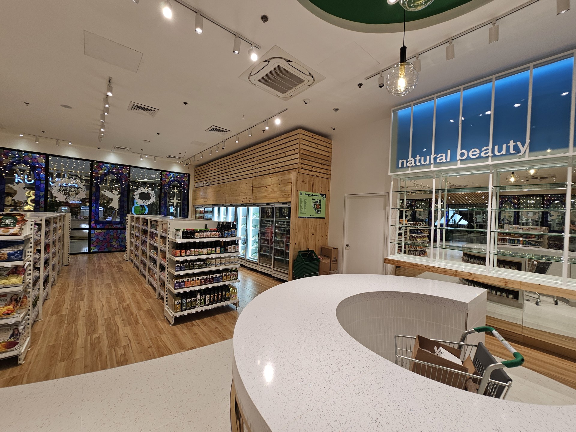 Curved display counter and retail interior at Healthy Options.