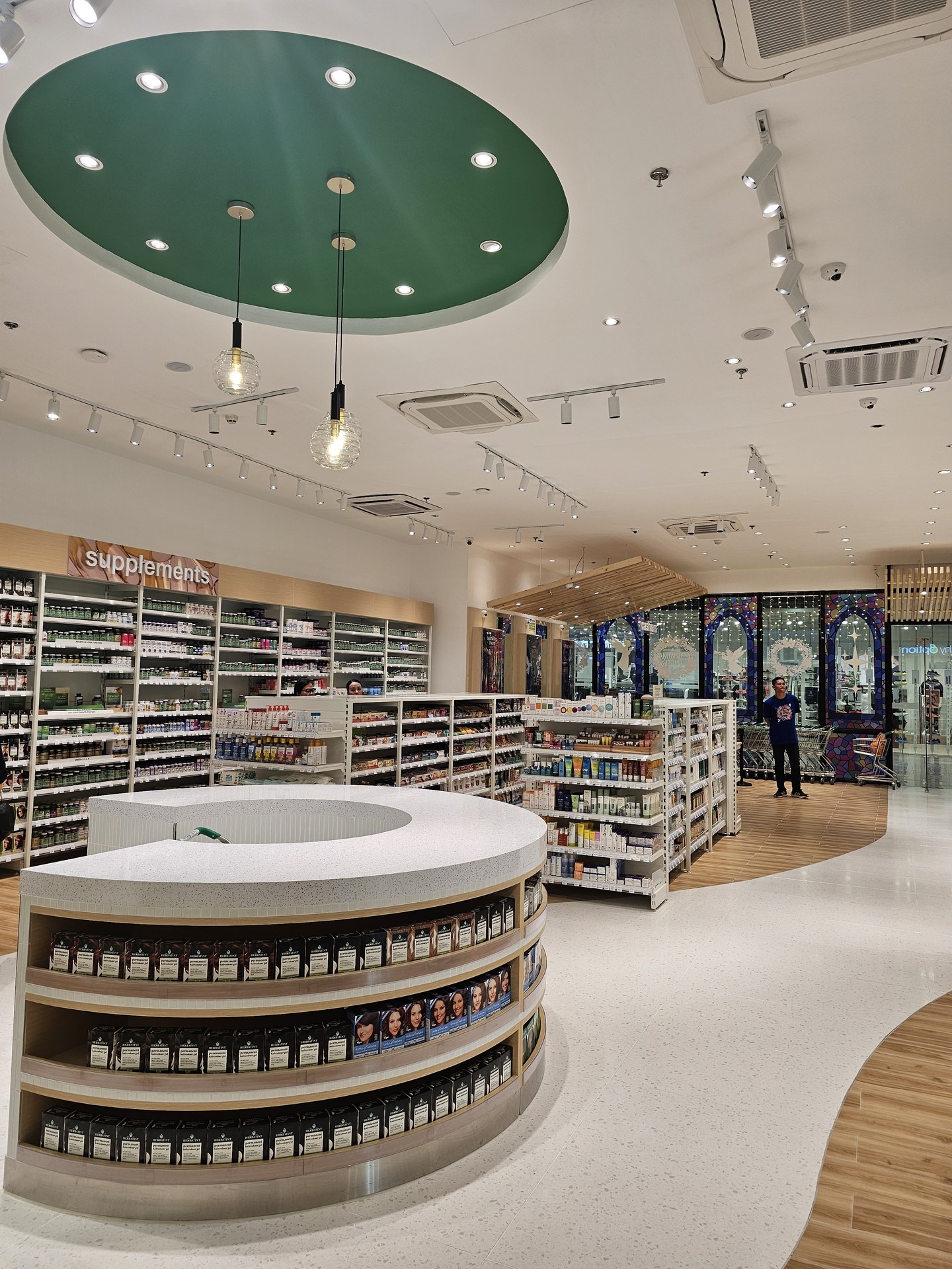 Circular ceiling feature and display counter at Healthy Options.