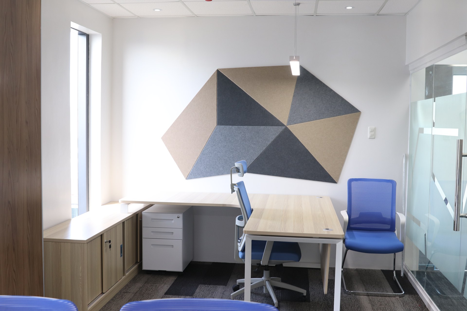 Private office with geometric wall treatment at the Manila Water Cebu office.