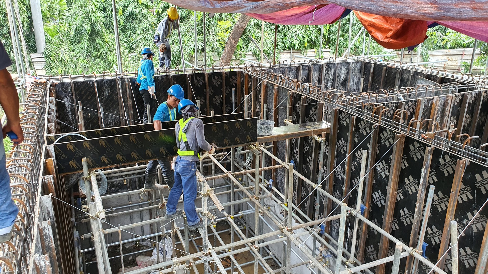 Reinforcement and formwork during tank construction.