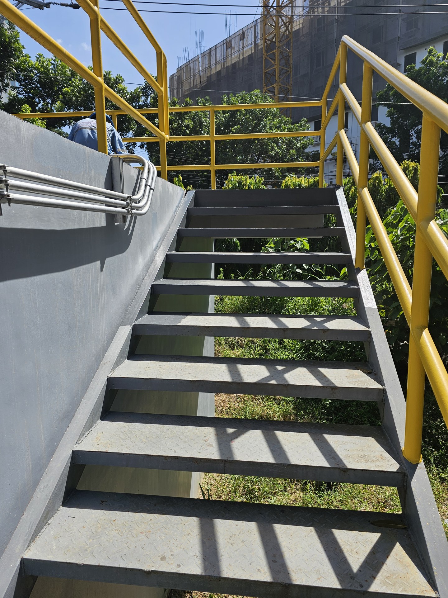 Steel access stair and handrails at the dehydration tank.