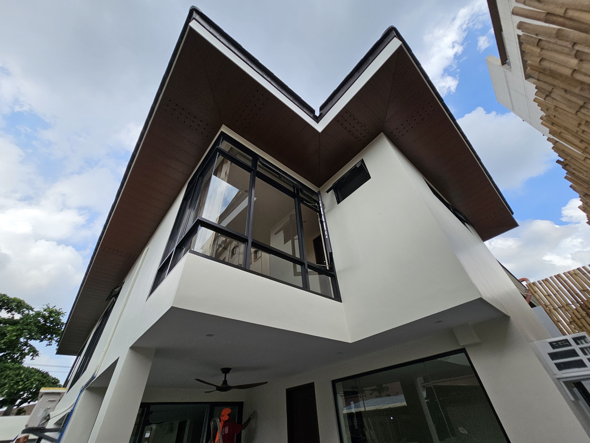 Roofline and glazed corner of the Paradise Village residence.