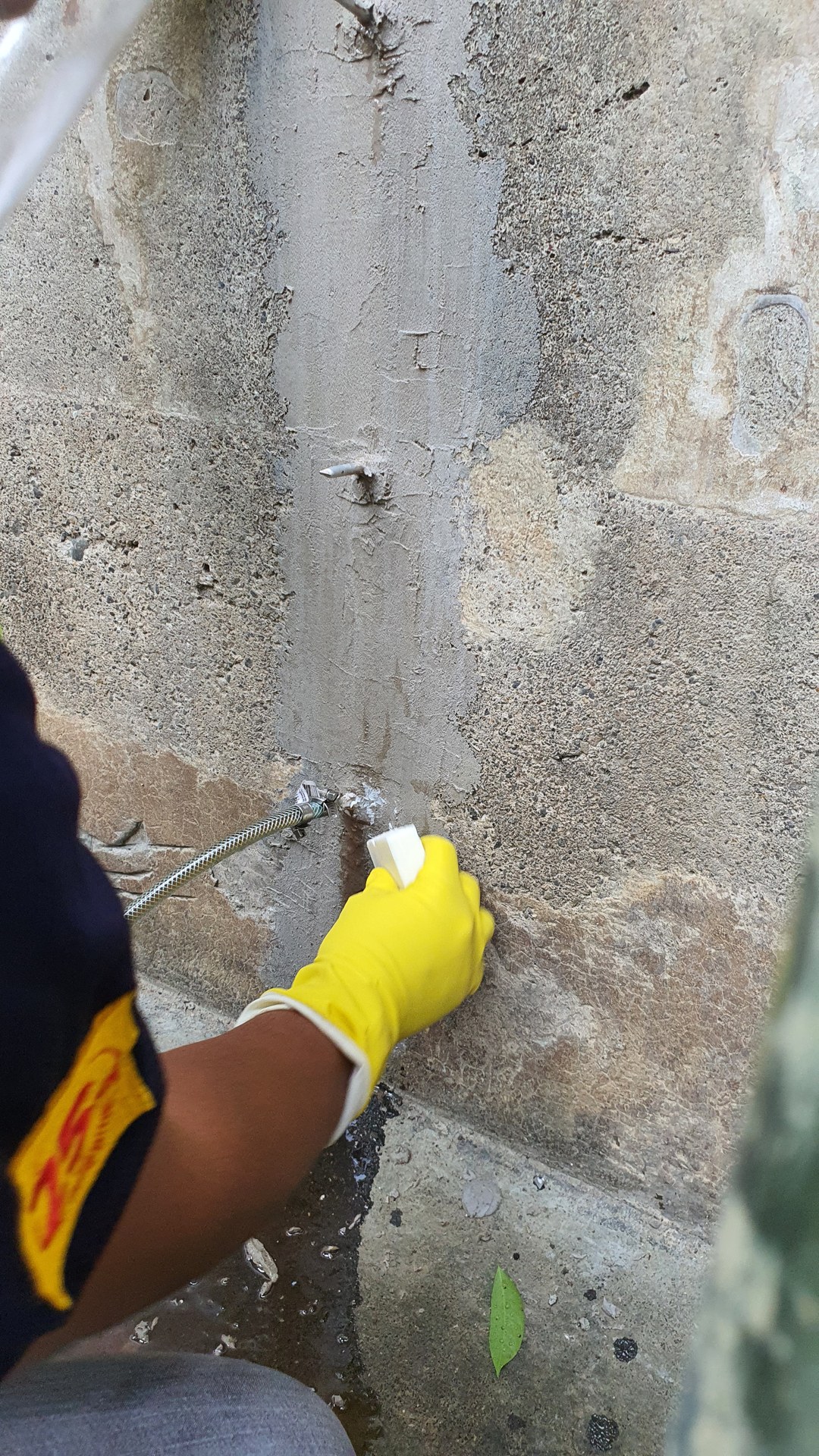 Close-up of repair work on the basin wall.